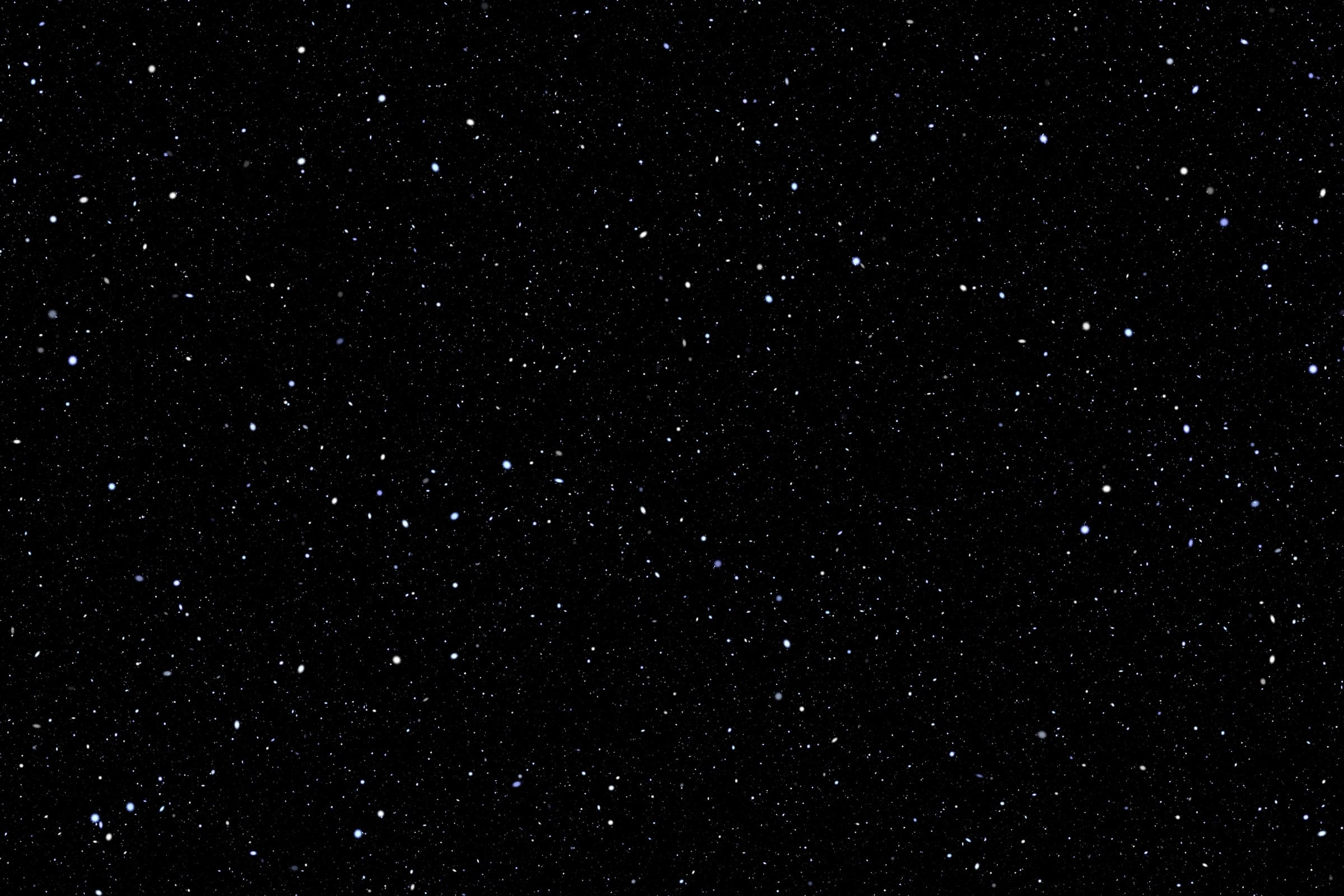 Realistic space sky which is black with stars scattered across.